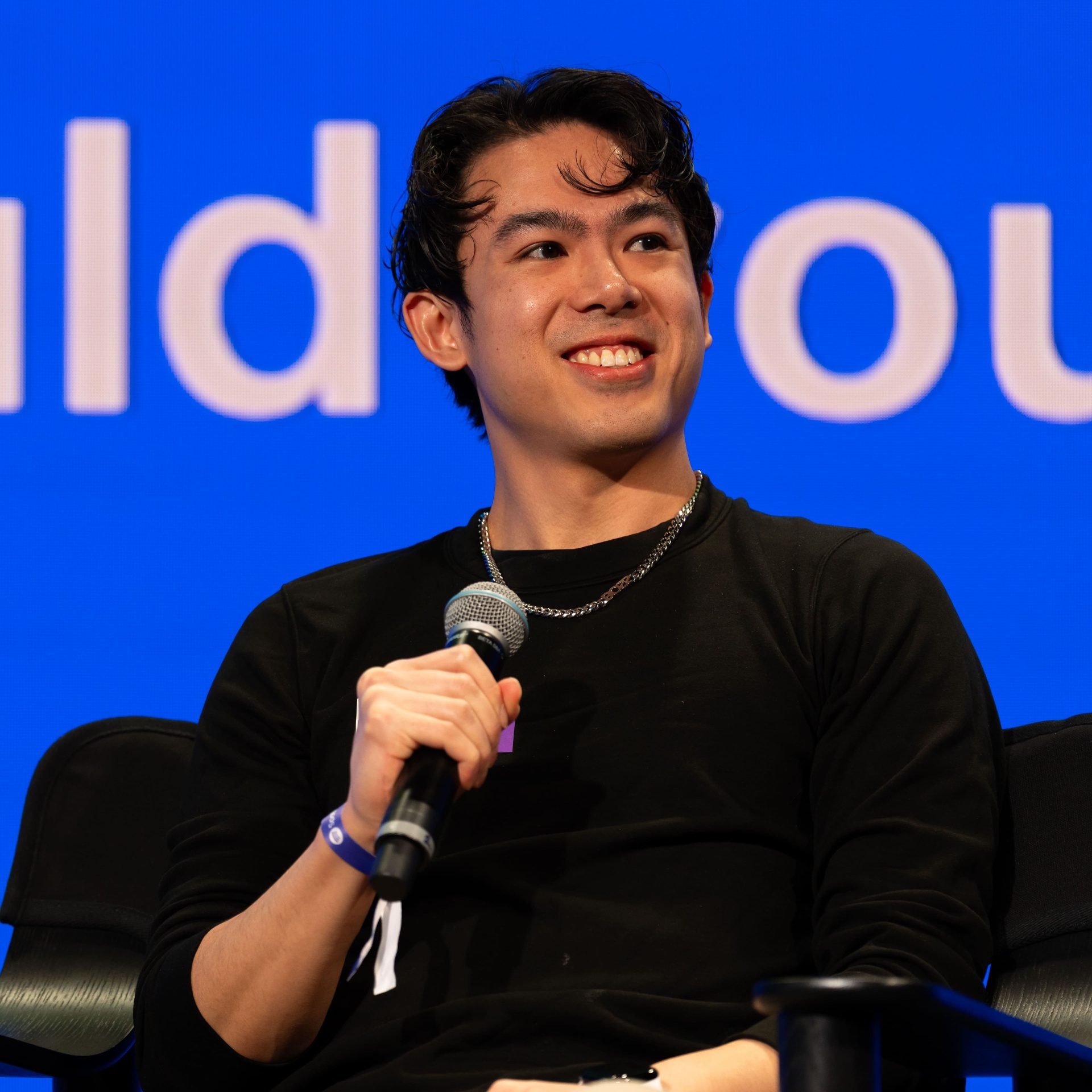 Tony Kwok speaking on stage